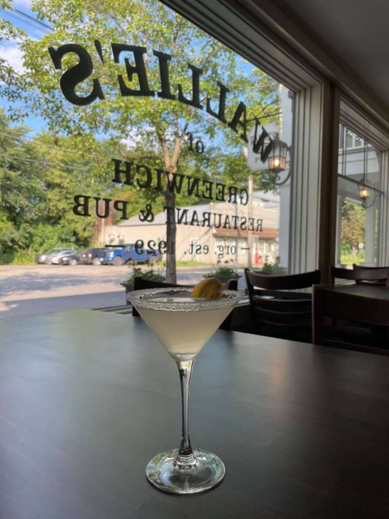 lemoncello martini sitting in front of a window