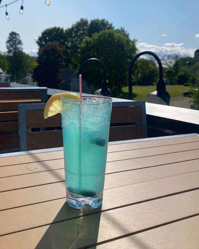 a blue drink sitting on a table