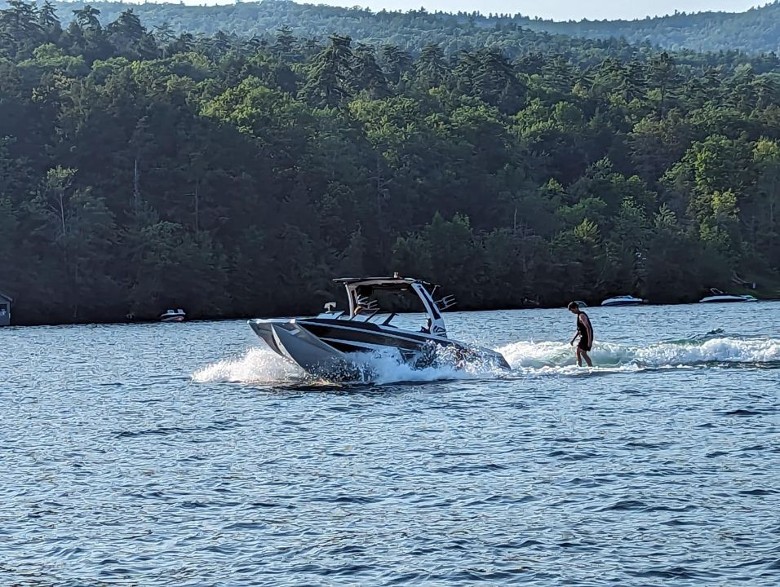 a motorboat pulling a waterskier