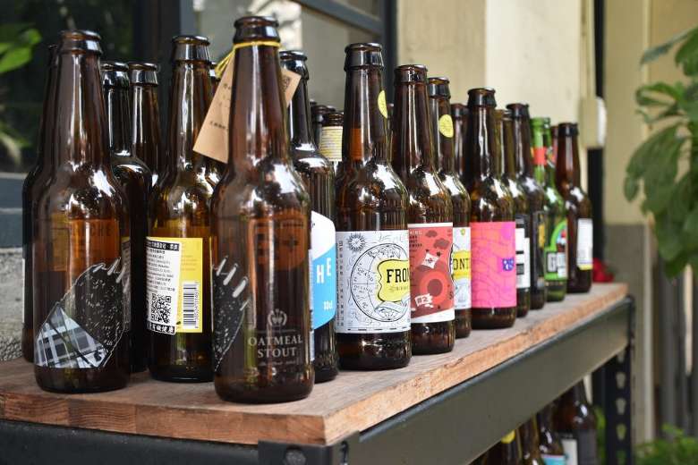 a variety of beer bottles on a table