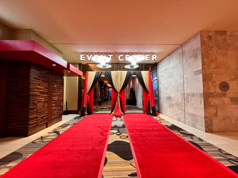 red carpet entrance leading to an Event Center