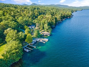 aerial view of a shoreline of a blue lake