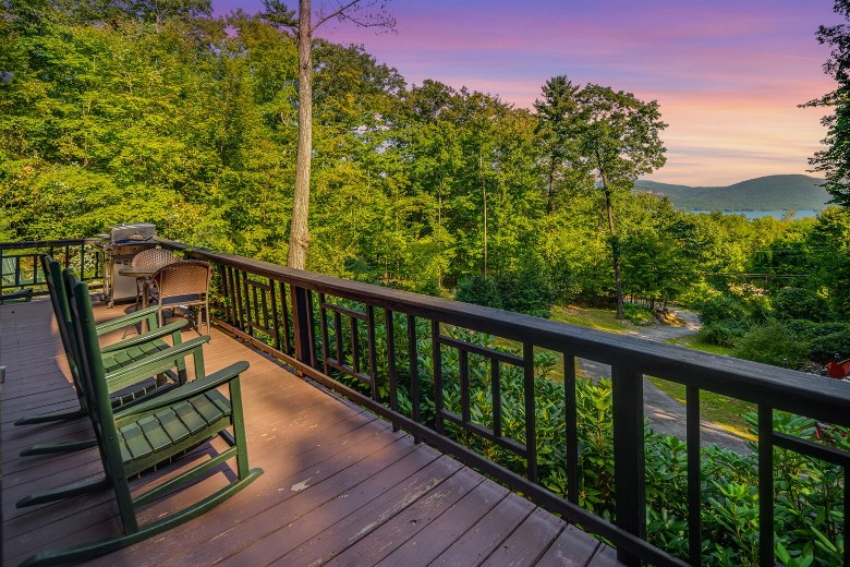 deck overlooking lake and mountain