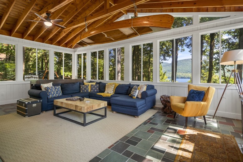 vaulted porch with lake and mountain view