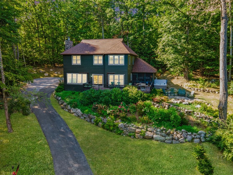 dark green house in woods