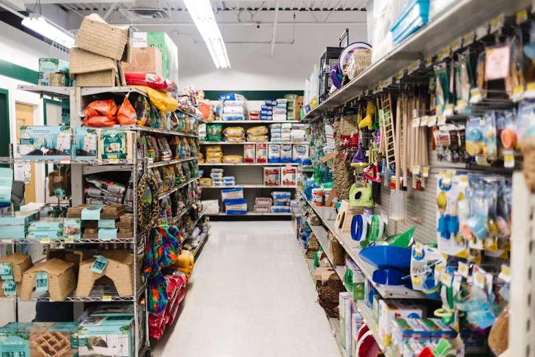 aisle in a pet shop with toys and supplies