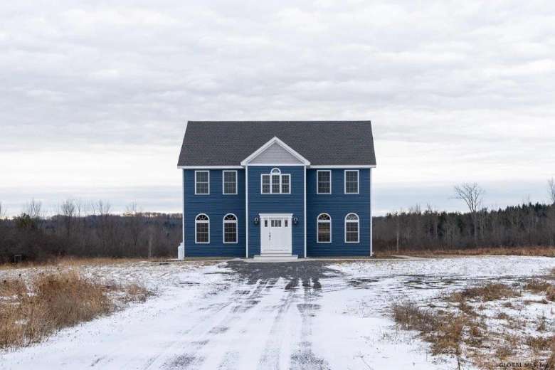 exterior view of a blue house in winter