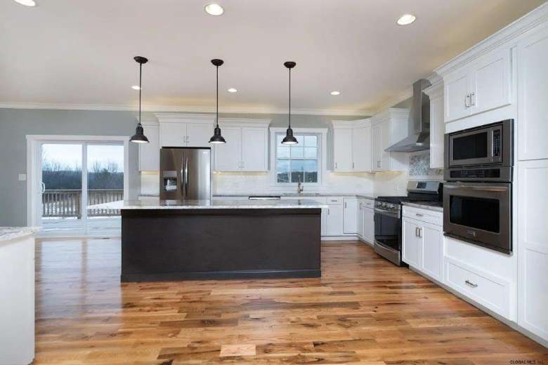 a spacious kitchen with appliances installed
