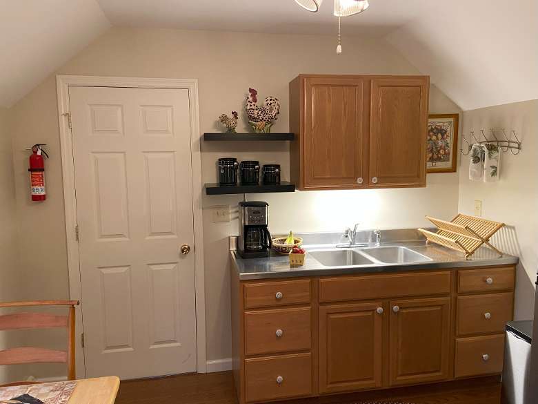 kitchen area with cabinets and sink