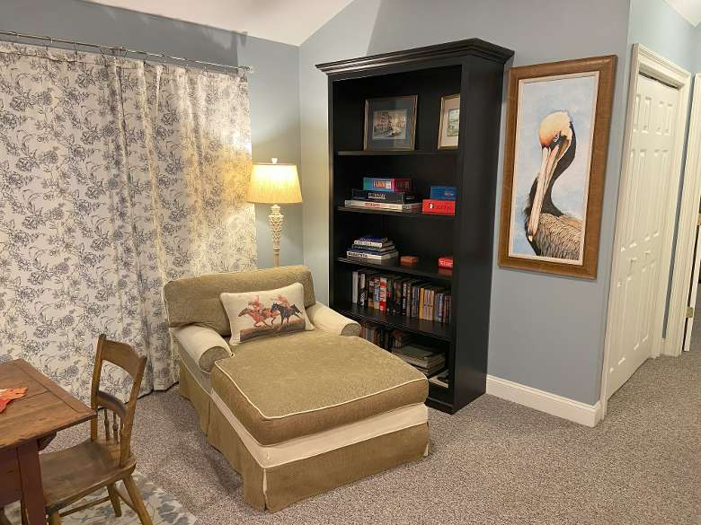 reading nook with loveseat and bookshelf