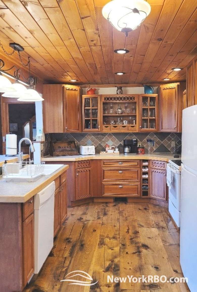 kitchen with wood ceilings and cabinets