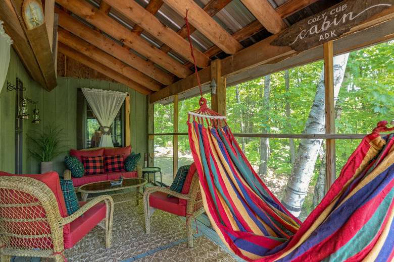 screened in porch with hammock, chairs