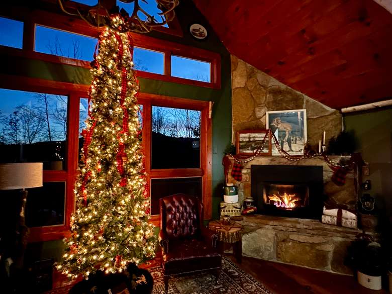 The cabin is decorated with a 12' Christmas tree for the holidays.