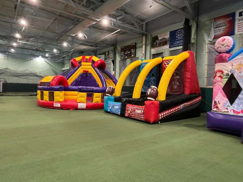 bounce house games in a turf area
