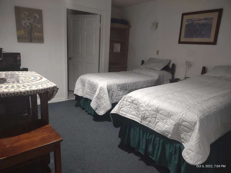 two twin beds in motel room