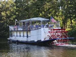 sternwheel boat going down a river