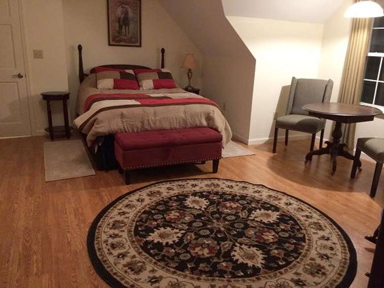 room with queen bed and rug