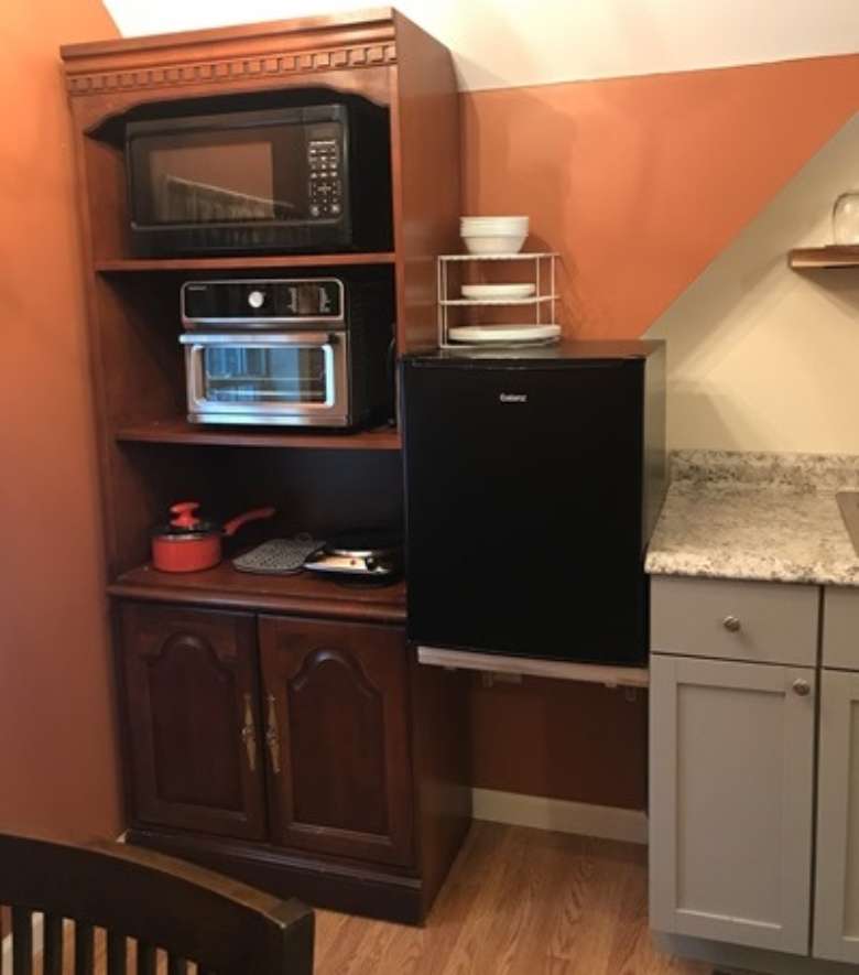 kitchen area with cabinets and appliances