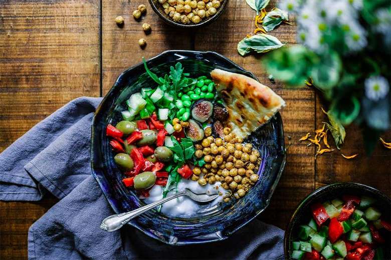 bowl of ayurvedic greens, lentils and bread