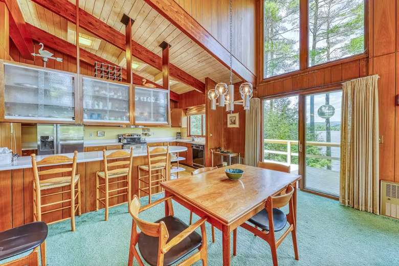 dining room and kitchen with cathedral ceiling