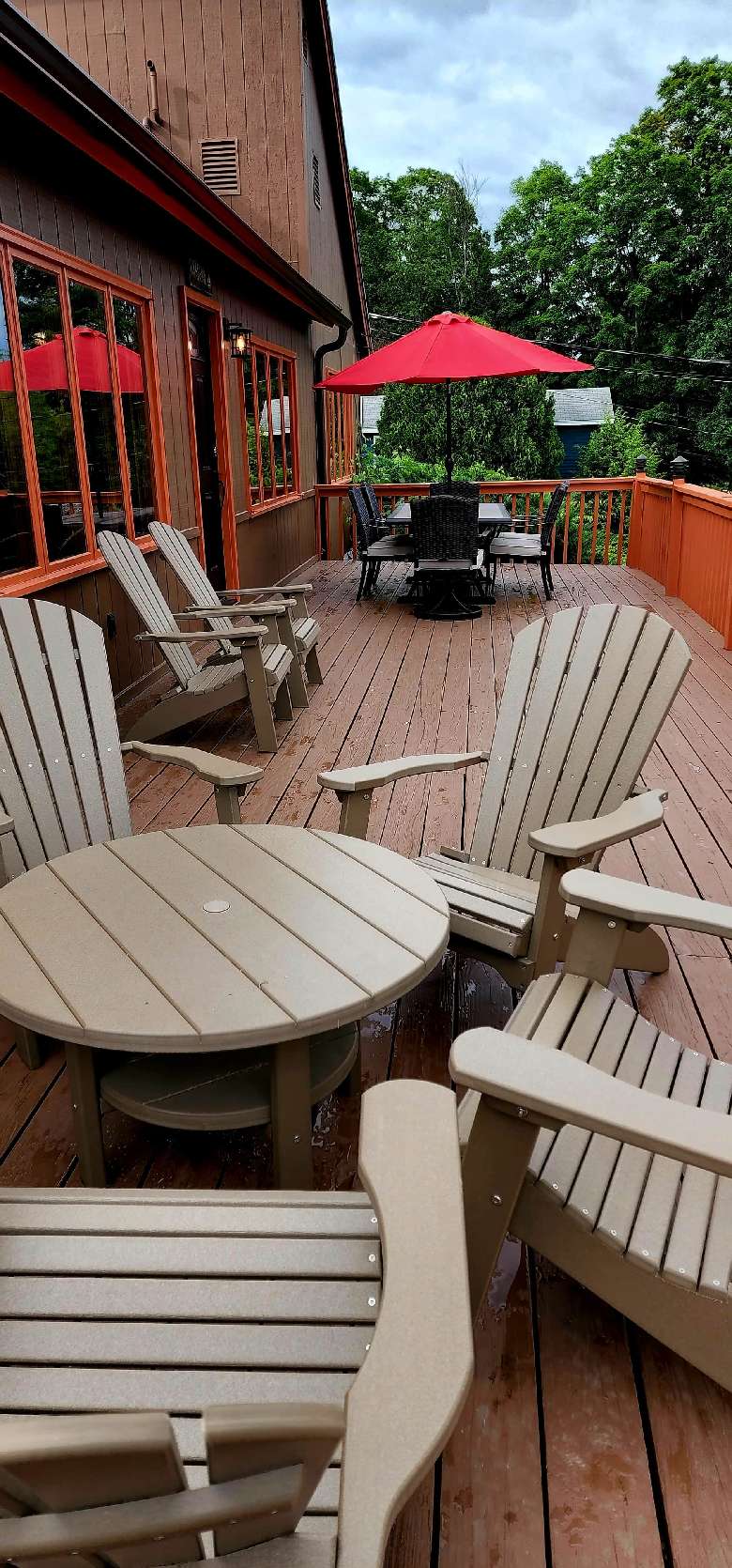 deck with plastic furniture chairs and table