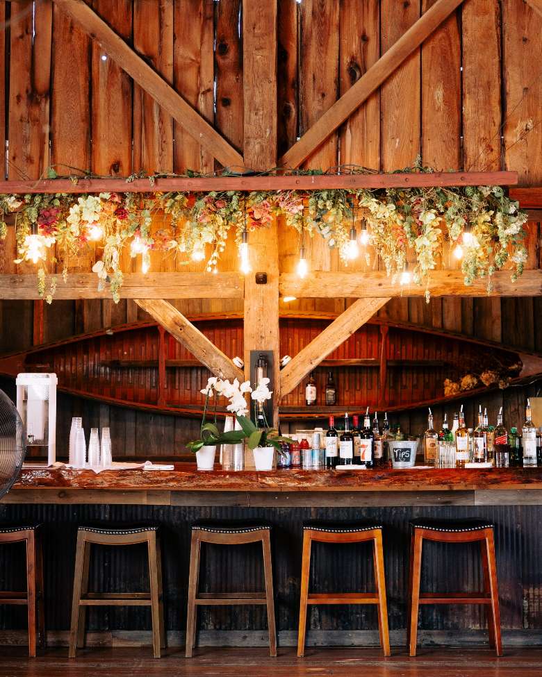 barn bar with barstool seats