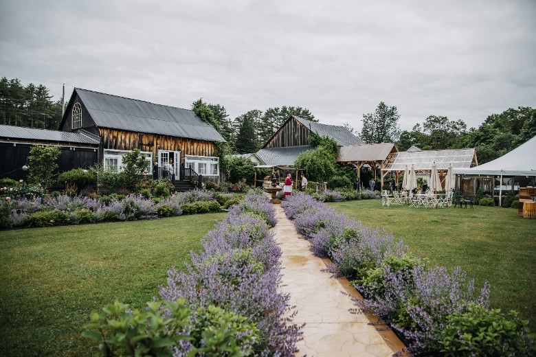 barns and pathway with flowers