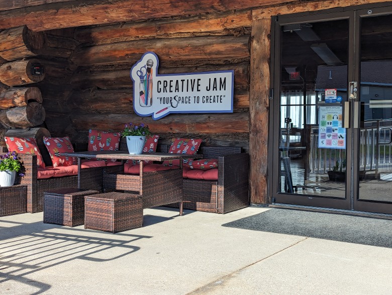 Seating arrangement on a front porch of a log cabin