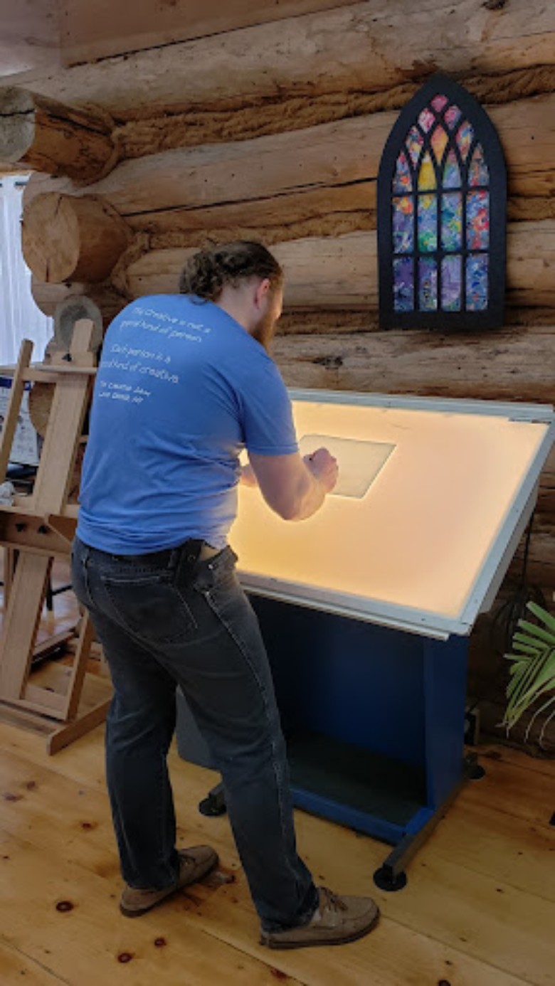 man working at standing desk