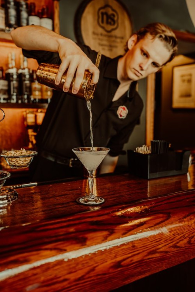 man pouring cocktail