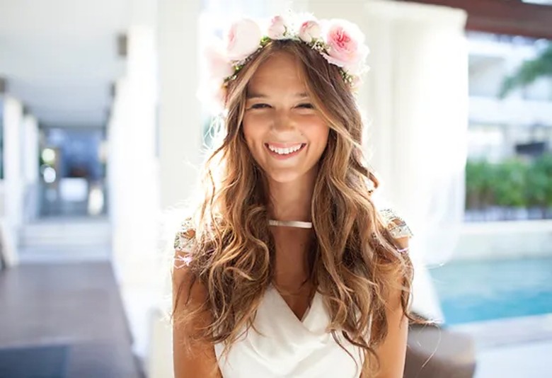 bride wearing a pink floral headband