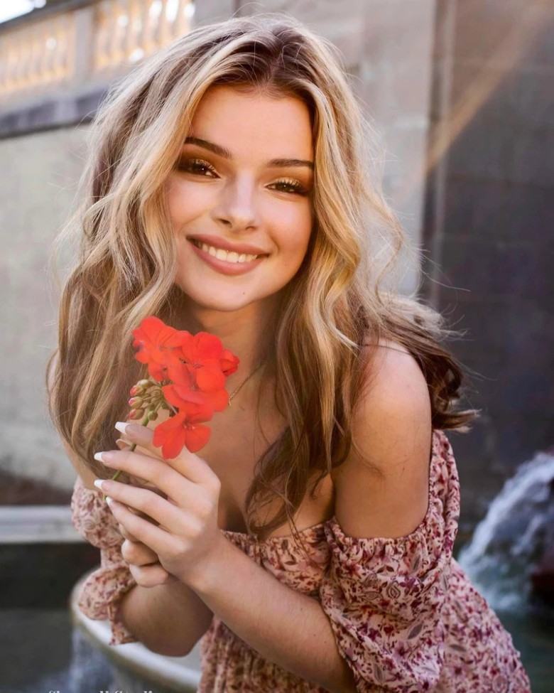 woman holding flower