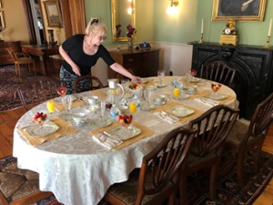 woman setting breakfast table