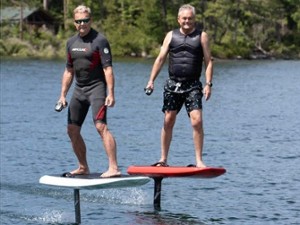 2 men e-foiling on lake
