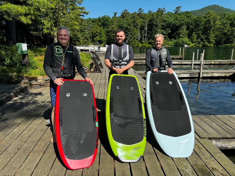 three men with e-foils