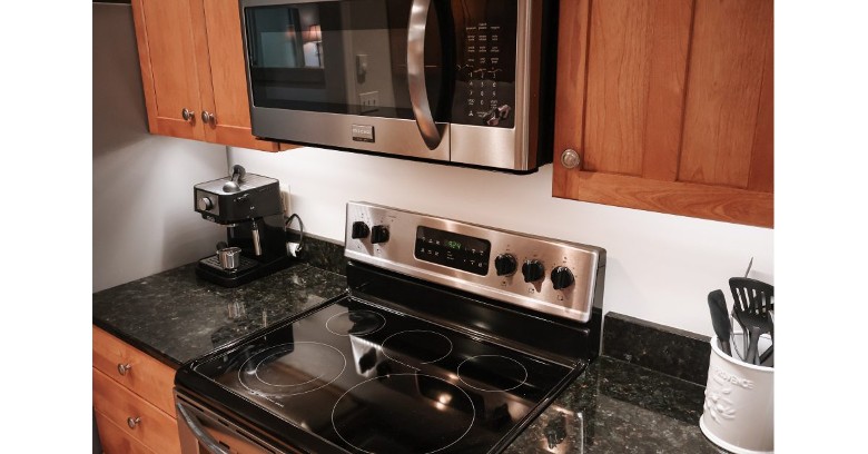 kitchen with range and coffee maker