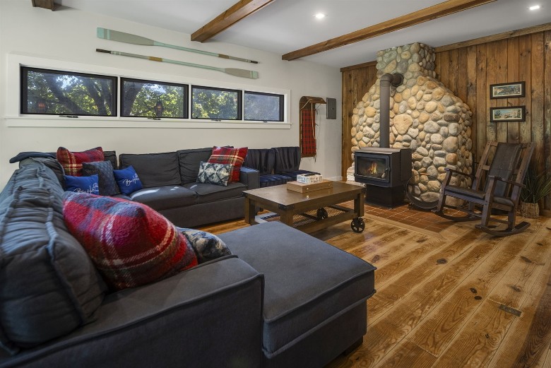 living room with stone fire place