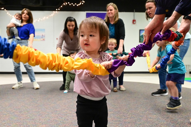 child playing with a family group