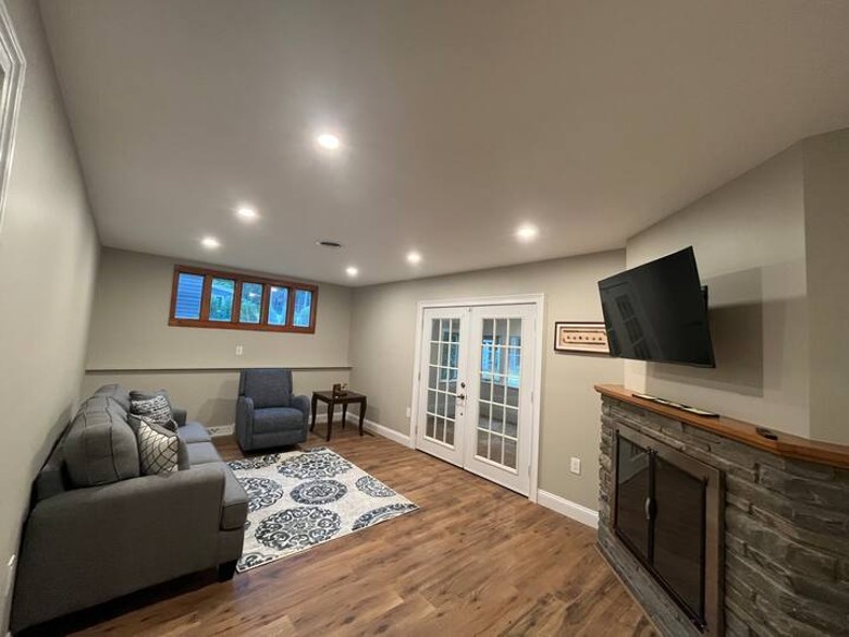 Living Room with couch, chair, TV, and fireplace