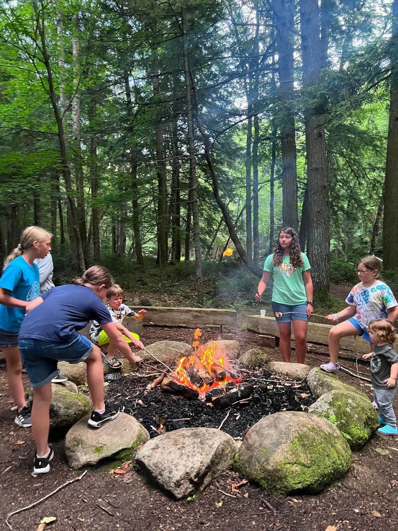 group of kids roasting s'mores