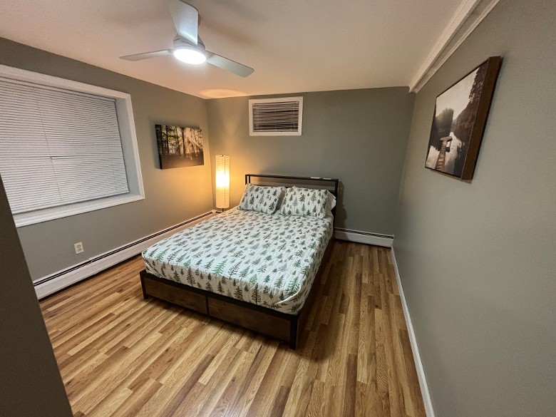 bedroom with a bed and pictures hanging on the walls