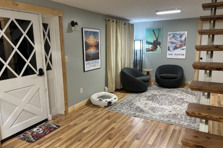 entrance area of a house with two sofa chairs