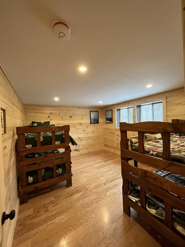 guest room with two sets of bunk beds