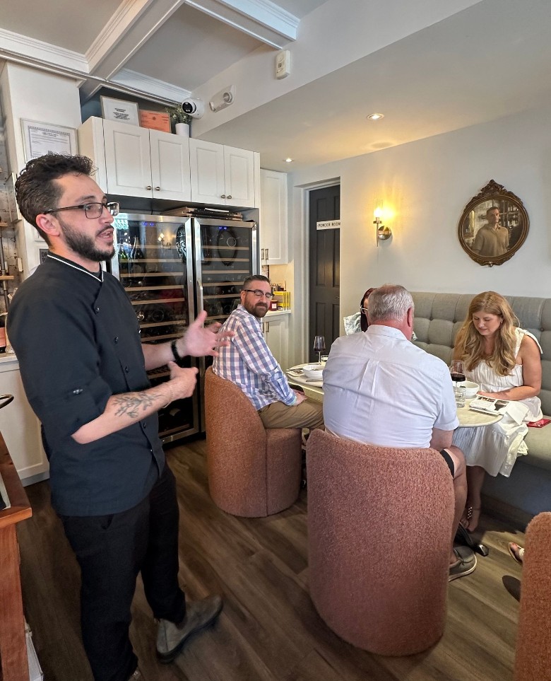 man speaking at a wine tasting
