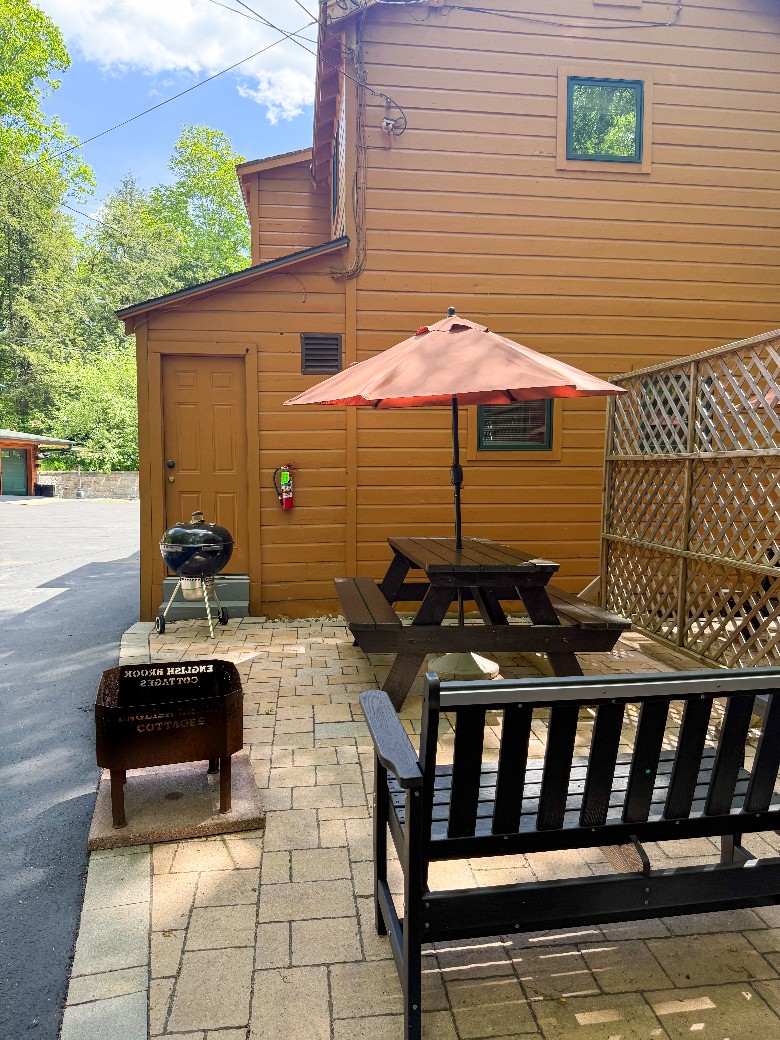 Patio with BBQ grill, a firepit, bench and a picnic table for added enjoyment