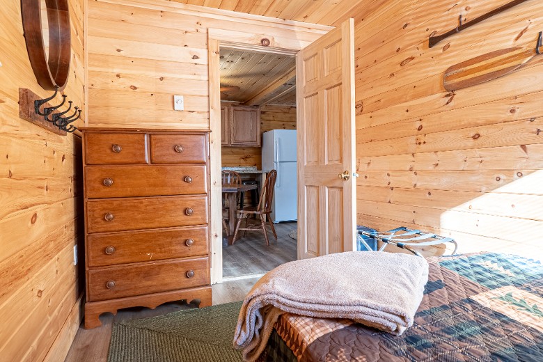 The third bedroom has a full bed with a dresser for added storage