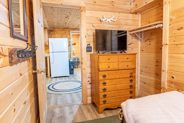 The second bedroom feature a full-size bed. The futon is located on the insulated enclosed porch