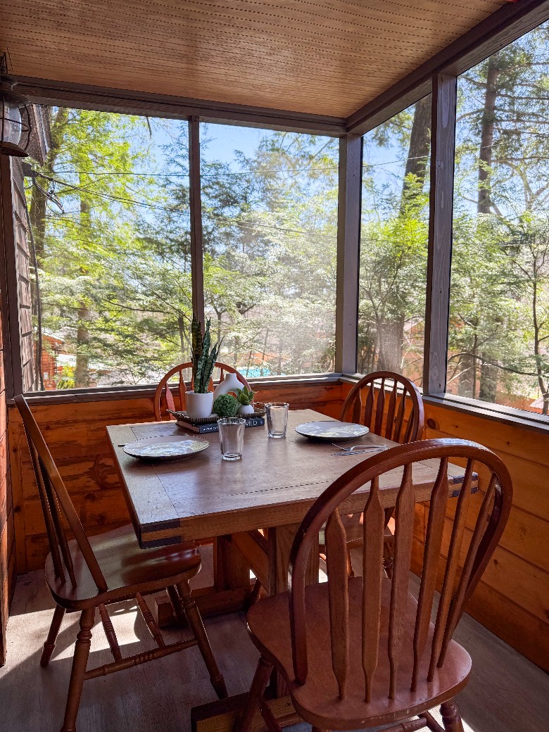 Dining room table located on the screened in porch