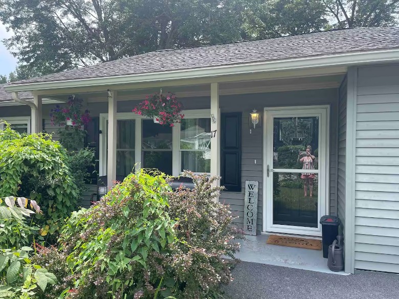 Welcoming front door of a home with surrounding greenery