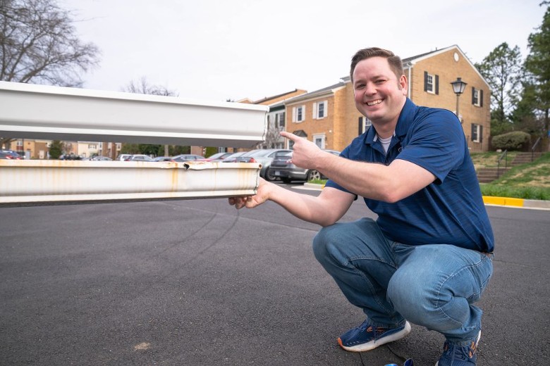 man holding gutters